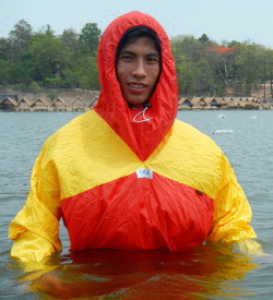 Lifeguard in wet red anorak